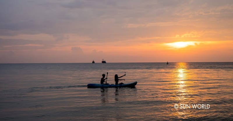 Kayaking on a romantic sunset in the romantic sea